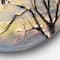 Designart - Rustic Birds On A Tree In Winter Village - Farmhouse Metal Circle Wall Art